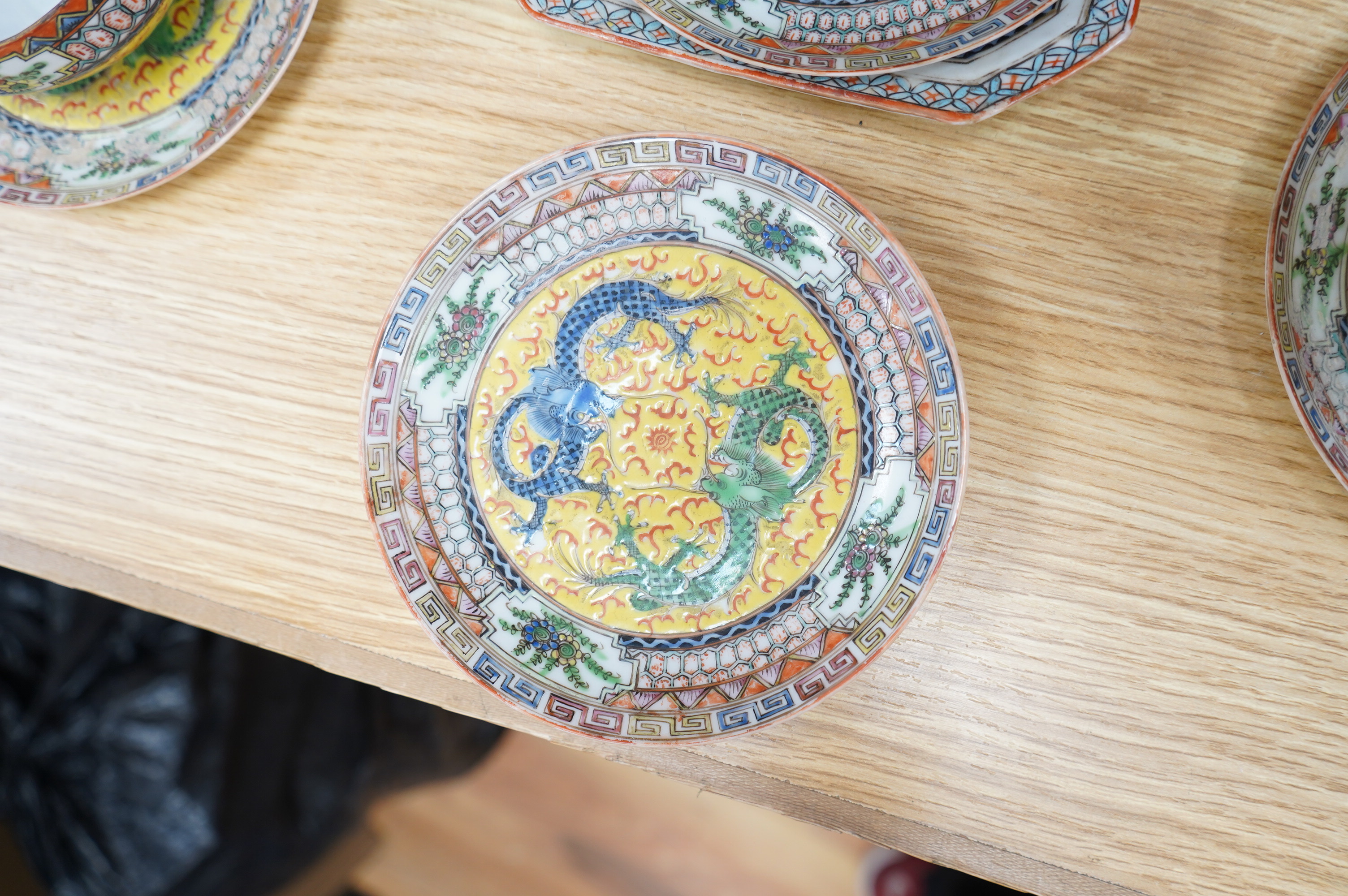 An early 20th century Chinese eggshell porcelain part tea set, with a yellow ground and coloured dragons (22). Condition - cups have slight chipping to top edges